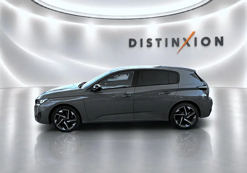 Peugeot 308 gris selenium vue de profil côté gauche, avec jantes alliage noires et décorations modernes.