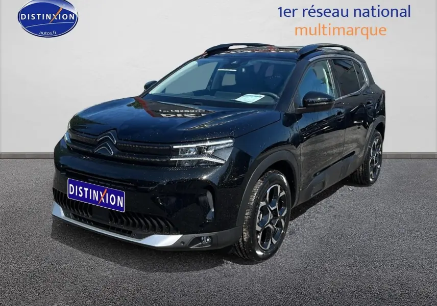 Citroën C5 Aircross noir en 3/4 avant droit avec toit bi-ton et jantes alu 18 pouces visibles.