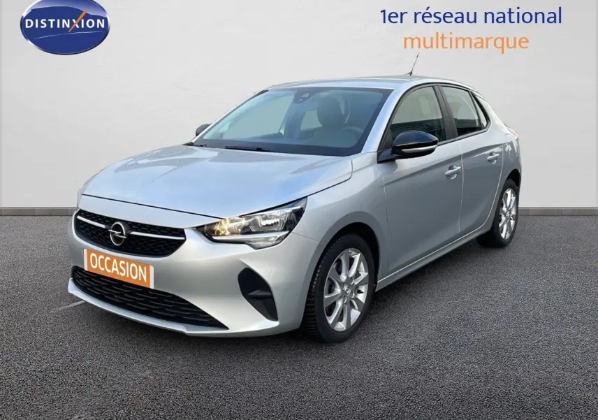 Opel Corsa gris kristall metal vue 3/4 avant droit, avec calandre noire et jantes alliage argentées.