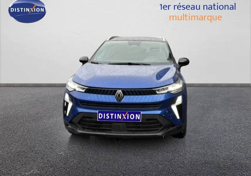 Vue avant d'un Renault Captur 2025 bleu Iron Metal avec toit noir, calandre et phares LED distinctifs.