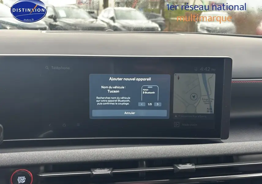 Écran tactile central du tableau de bord du Hyundai Tucson 2026 avec interface Bluetooth et navigation visible.