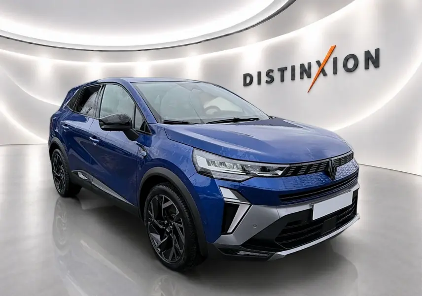 Renault Symbioz 2026 bleu iron en 3/4 avant droit, avec jantes noires et calandre distinctive esprit Alpine.
