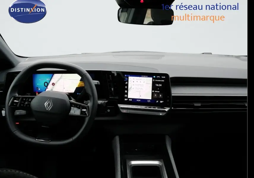 Vue intérieure frontale du tableau de bord du Renault Austral gris schiste avec écran tactile et volant multifonction.