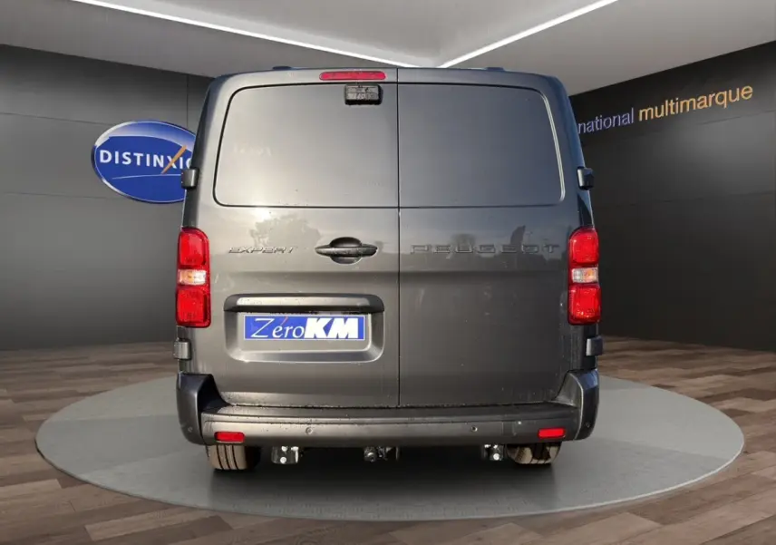 Vue arrière du Peugeot Expert Fourgon XL gris foncé avec portes battantes et feux rouges visibles.