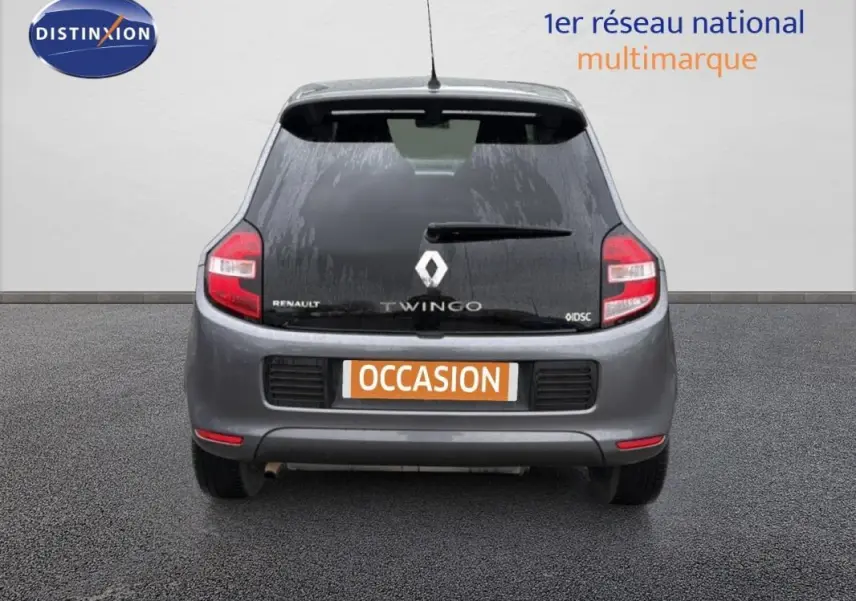 Vue arrière d'une Renault Twingo III gris foncé avec vitres surteintées et plaque "OCCASION" visible.