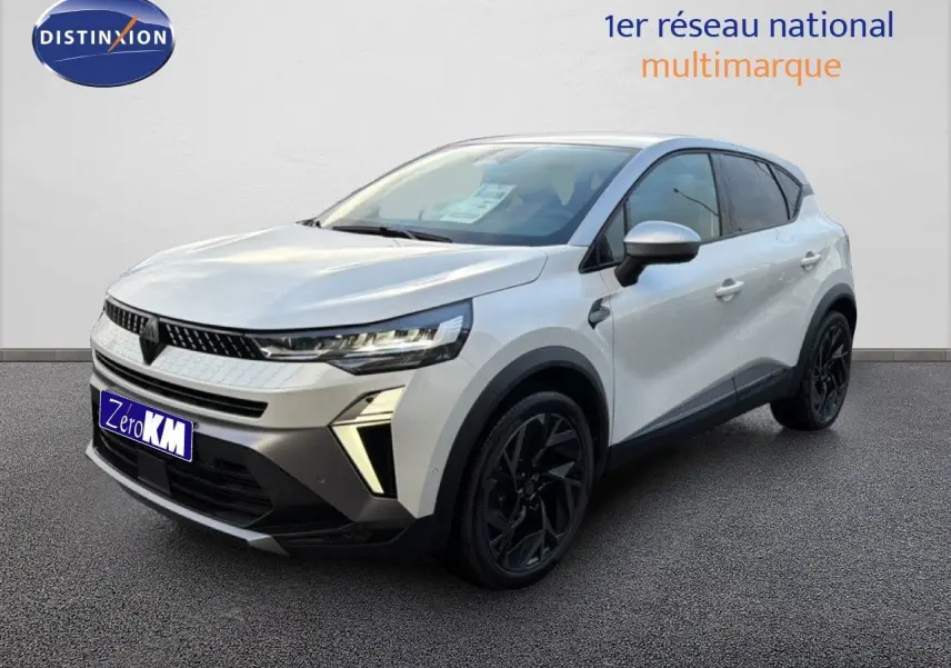 Renault Captur 2025 blanc nacré vue 3/4 avant droit avec toit gris et jantes noires distinctives.