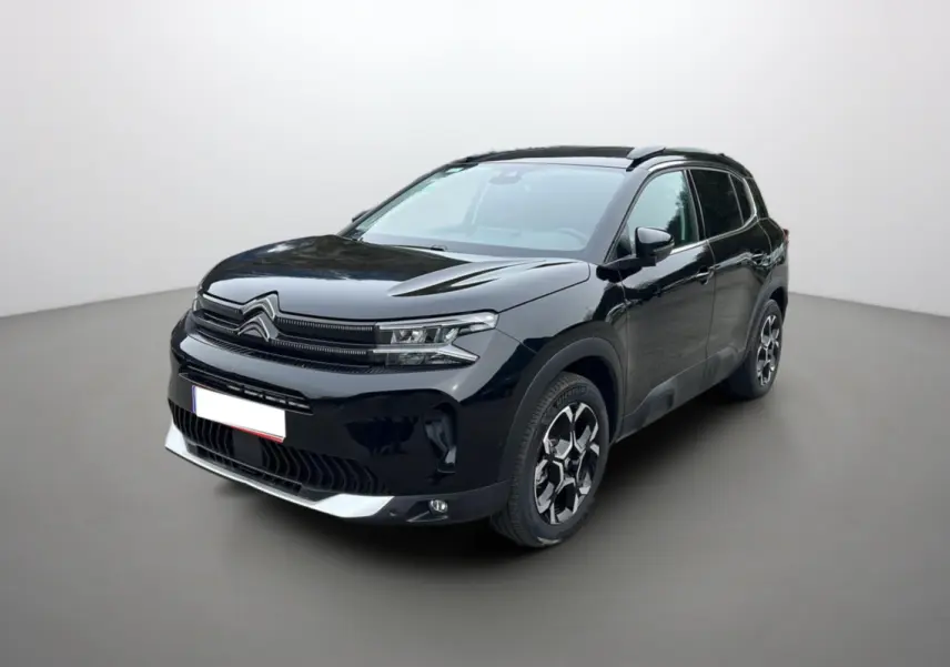 Citroën C5 Aircross Hybrid noir en 3/4 avant droit, avec jantes alu 18 pouces et barres de toit longitudinales visibles.