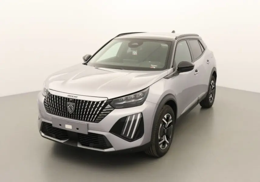 Peugeot 2008 gris Artense toit noir en 3/4 avant droit, mettant en valeur la calandre distinctive et les feux LED verticaux.