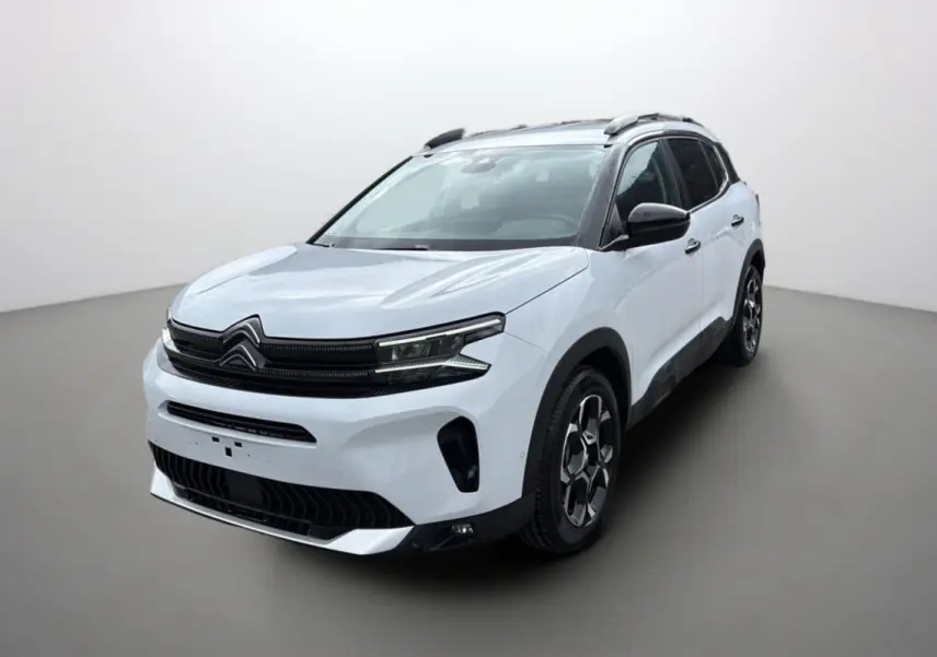 Citroën C5 Aircross Hybrid blanc okénite en 3/4 avant droit avec barres de toit et jantes alu 18 pouces.