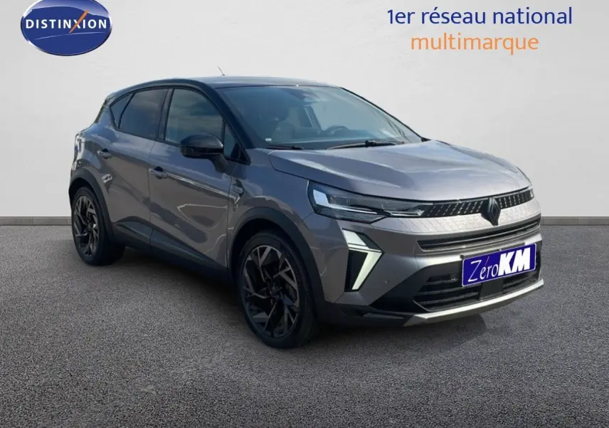 Renault Captur E-Tech hybride gris cassiopée métal avec toit noir, vue 3/4 avant droit mettant en valeur ses optiques LED.