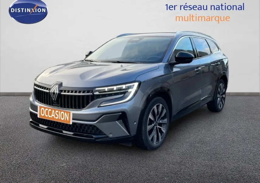 Renault Espace 2024 gris schiste métal en 3/4 avant droit avec calandre distinctive et jantes bi-ton.