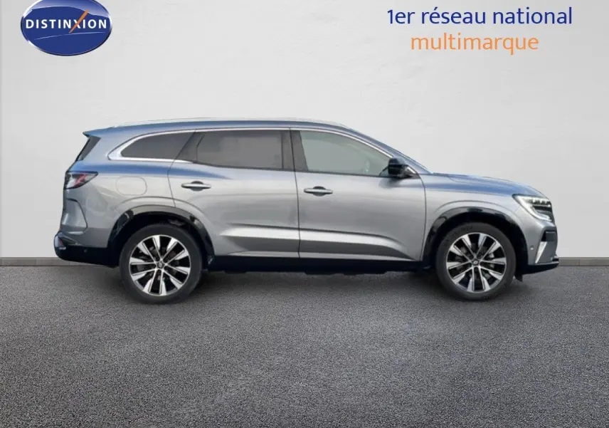 Profil droit du Renault Espace 2024 gris schiste métal avec jantes alliage et lignes fluides modernes.