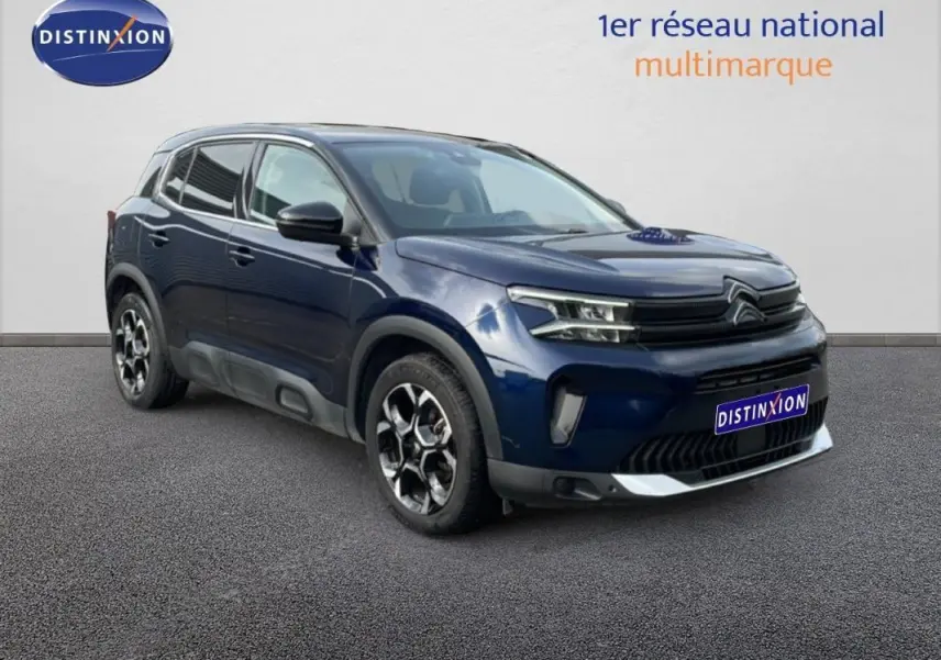 Citroën C5 Aircross bleu 3/4 avant droit, avec jantes aluminium et détails noirs contrastants.