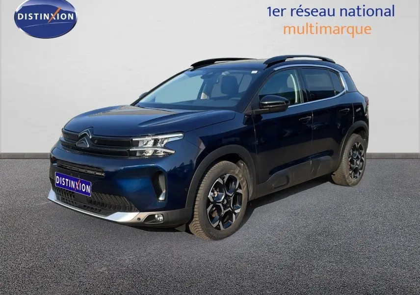 Citroën C5 Aircross bleu Eclipse métal en 3/4 avant droit, avec jantes noires et toit noir contrasté.