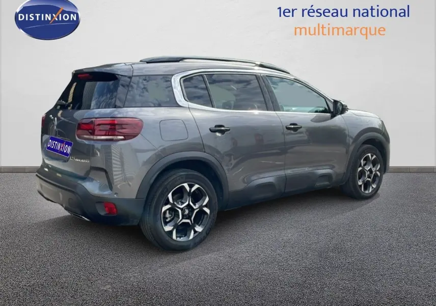 SUV Citroën C5 Aircross gris platinium métal, vue 3/4 arrière droit, avec jantes alliage et toit panoramique.