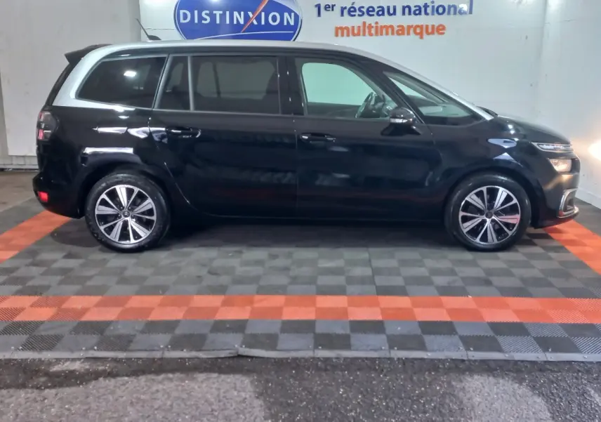 Profil droit d'un Citroën Grand C4 Spacetourer noir, avec jantes alliage et toit blanc contrastant.