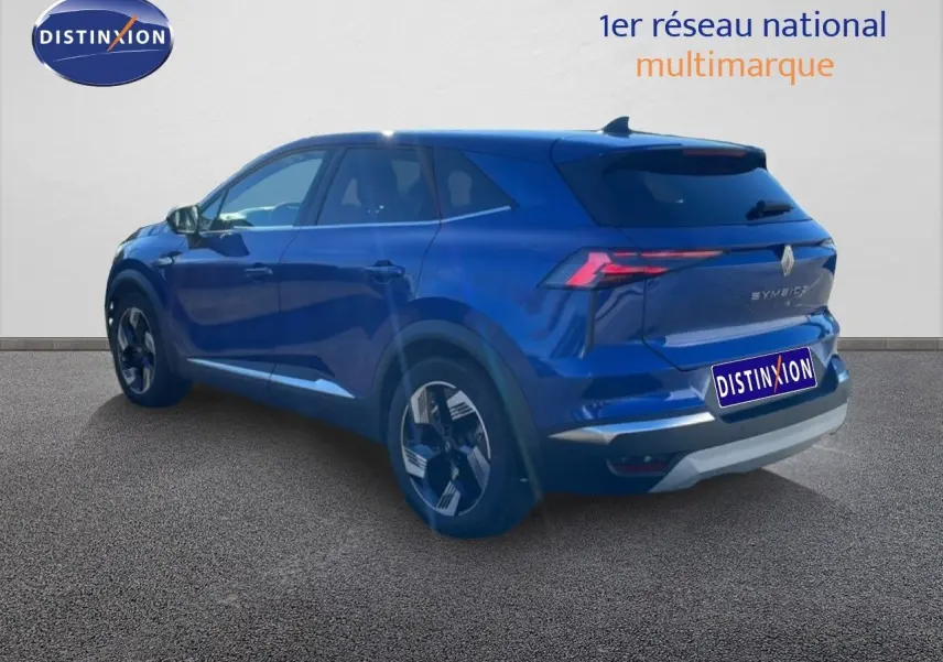 Vue 3/4 arrière droite d'un Renault SYMBIOZ bleu Iron Metal avec feux LED et jantes modernes.