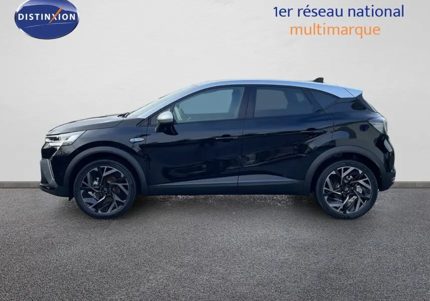 Profil côté gauche du Renault Captur E-Tech hybride 2025 noir étoile avec toit gris et jantes noires biton.