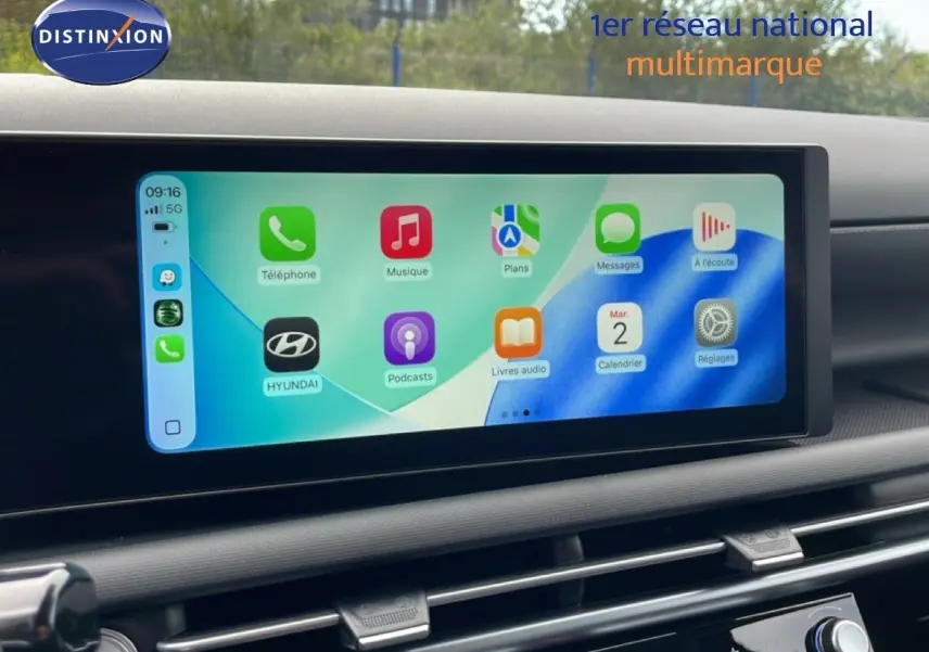 Écran tactile central du Hyundai Tucson 2026 affichant l'interface Apple CarPlay dans un intérieur noir.