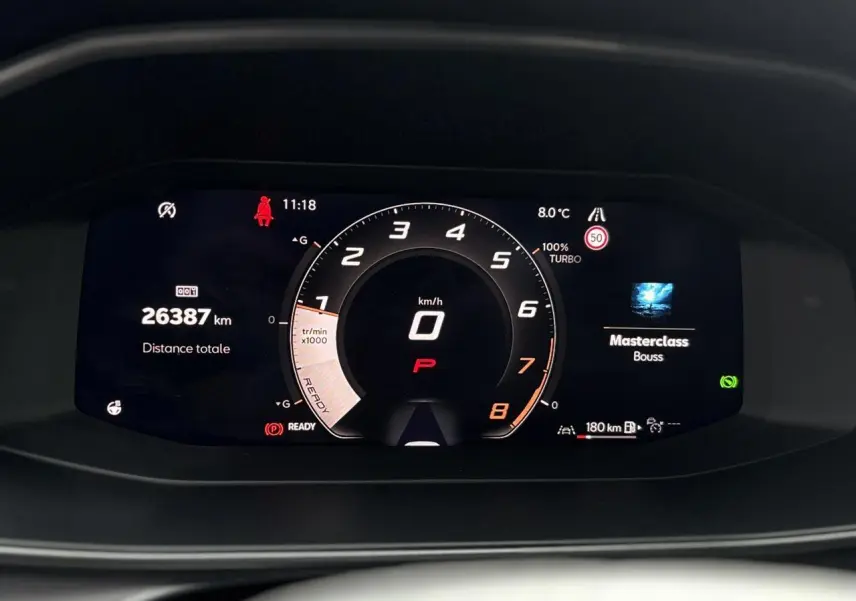 Affichage numérique du tableau de bord du CUPRA Leon ST 1.5 e-TSI, montrant le compteur central et l'odomètre à 26387 km.