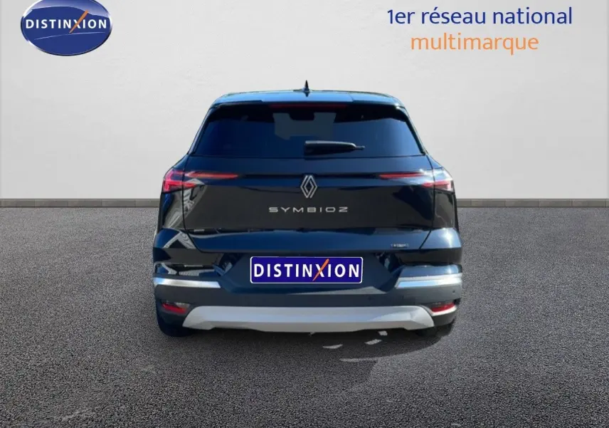 Vue arrière d'une Renault Symbioz noire étoile métal, soulignant ses feux arrière fins et son logo central.