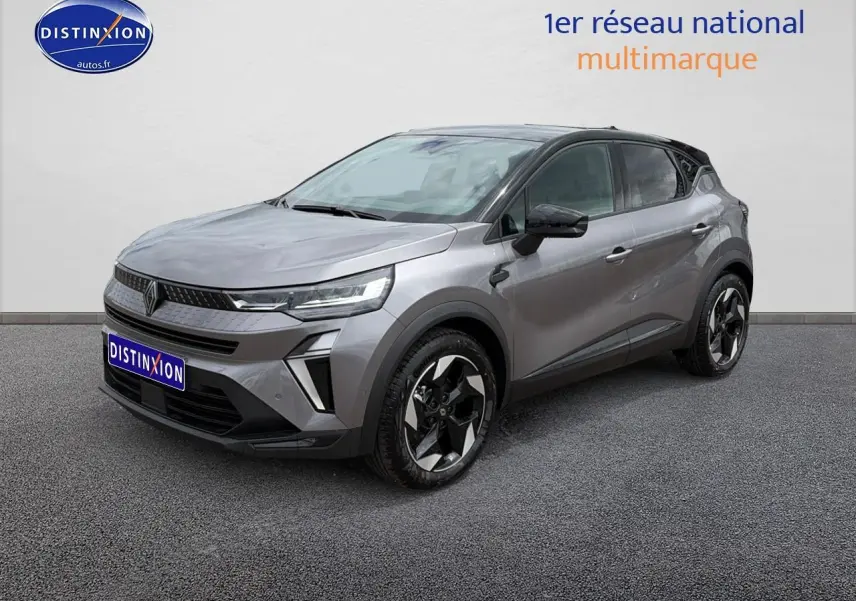 Renault Captur 2026 gris Cassiope toit noir en 3/4 avant droit, jantes alu et feux LED distinctifs.