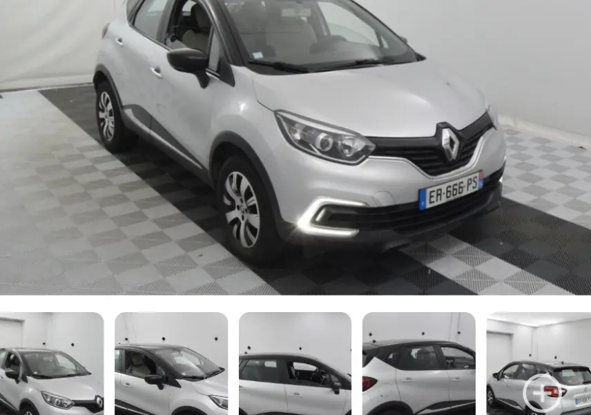 Renault Captur gris vue 3/4 avant droit, feux diurnes allumés, jantes aluminium et toit noir contrasté.