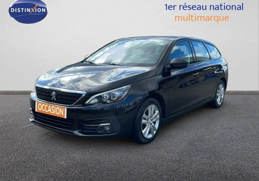 Peugeot 308 SW noir perla nera métal vue 3/4 avant droit avec calandre et phares LED visibles.