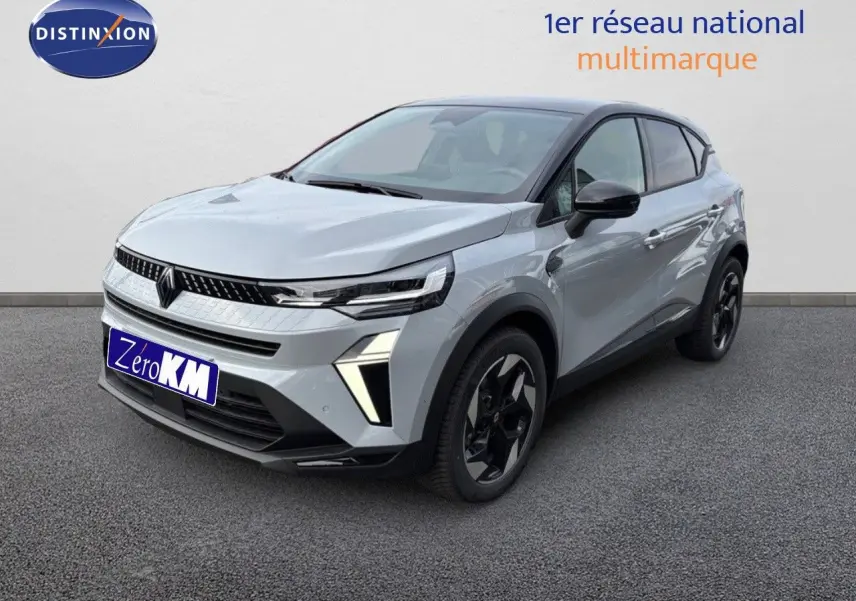 Renault Captur II hybride gris Rafale métal avec toit noir, vue 3/4 avant droit sur sol gris.