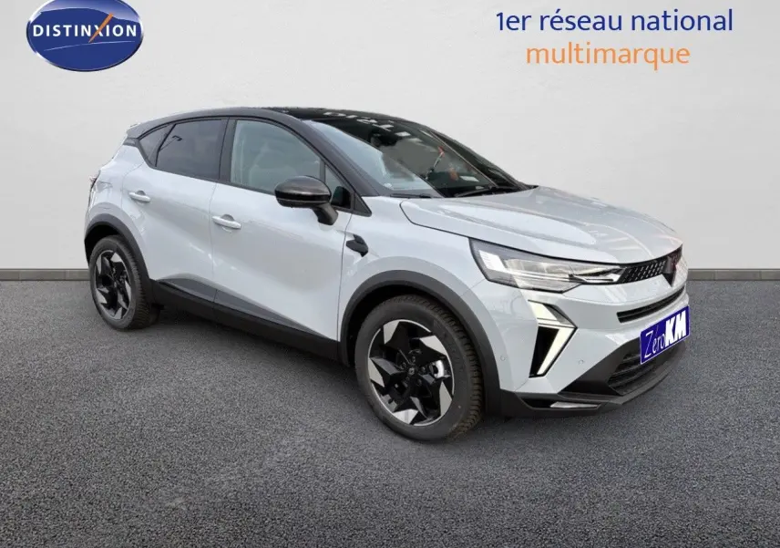 Renault Captur II hybride gris rafale métal avec toit noir, vu en 3/4 avant droit sur fond neutre.