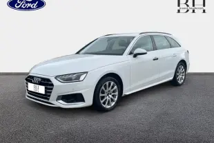 Audi A4 Avant blanc glacier métallisé vue 3/4 avant droit sur fond neutre avec jantes alu visibles.
