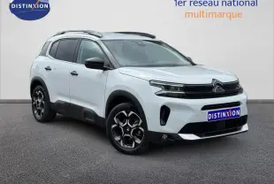 Citroën C5 Aircross blanc Okénite vue 3/4 avant droit avec jantes alu et barres de toit noires.