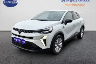 Renault Symbioz blanc nacré métal en 3/4 avant droit, avec feux LED et calandre noire distinctive.