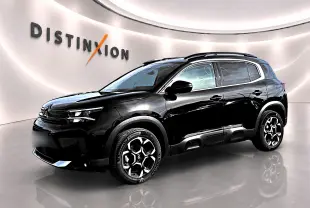 SUV Citroën C5 Aircross noir en vue 3/4 avant droit, avec jantes alu et barres de toit visibles.