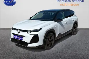 Vue 3/4 avant d'un Citroën C5 Aircross blanc avec toit noir et jantes alliage noires sur fond neutre.