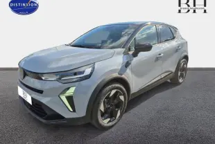 Renault Captur 1.6 E-Tech gris Rafale métallisé vue 3/4 avant droit avec toit noir et jantes noires distinctives.