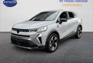 Renault Symbioz gris Rafale métal en 3/4 avant droit, SUV hybride avec détails noirs et jantes stylisées.