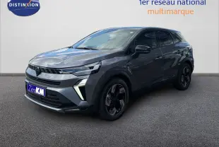 Renault Symbioz gris cassiopée métal, vue 3/4 avant droit, SUV hybride avec feux LED et jantes noires distinctives.