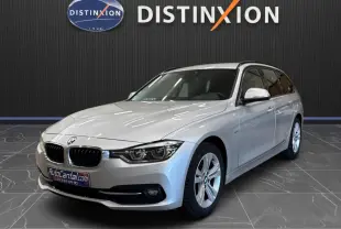 BMW Série 3 Touring F31 gris aluminium vue 3/4 avant droit, avec jantes alliage et calandre double haricot distinctive.