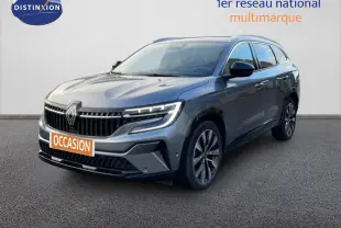 Renault Espace VI E-Tech gris schiste métal, vue 3/4 avant droit, avec calandre marquée et jantes alliage bicolores.