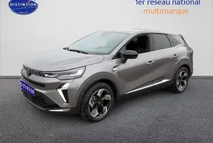 Renault Symbioz gris schiste en 3/4 avant droit, avec jantes alliage 18 pouces et feux LED distinctifs.