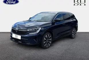 Renault Espace 2024 bleu foncé en 3/4 avant droit, avec jantes alliage et vitres arrière surteintées.