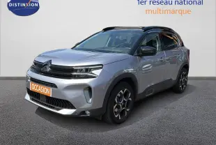 Citroën C5 Aircross gris acier en 3/4 avant droit, avec jantes bi-ton et toit noir contrasté.