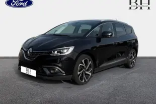 Renault Grand Scenic noir étoilé en 3/4 avant droit, avec jantes alliage et feux LED distinctifs.