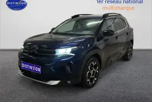 Citroën C5 Aircross bleu eclipse vue 3/4 avant droit avec feux LED allumés et barres de toit noires.