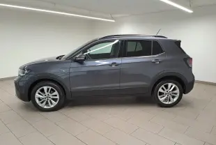 Volkswagen T-Cross gris cendré en vue de profil côté gauche, avec jantes alliage et toit noir.