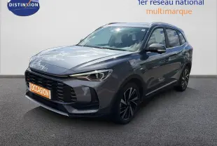 MG ZS 1.5L Hybrid+ 2025 en gris Hampstead, vue 3/4 avant avec calandre noire et jantes bi-ton.