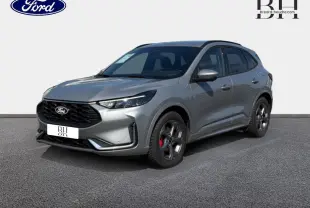 Ford Kuga gris Solar métallisé en 3/4 avant droit, avec jantes alliage et étriers de frein rouges visibles.