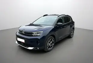 Citroën C5 Aircross Hybrid 145 en Eclipse Blue, vue 3/4 avant droit avec barres de toit et jantes alu 18 pouces.