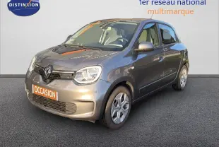 Renault Twingo gris acier vue 3/4 avant droit, compacte cinq portes avec phares arrondis et jantes acier.